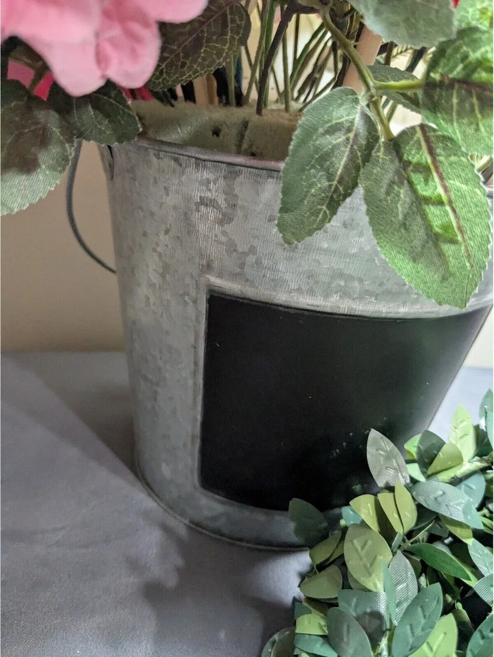 Artificial Flower Arrangement with Decorative Greenery and Shredded Paper Filler